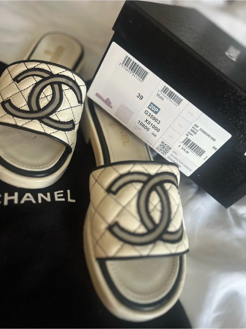 CHANEL White Quilted Slide Sandals with Black Logo Trim